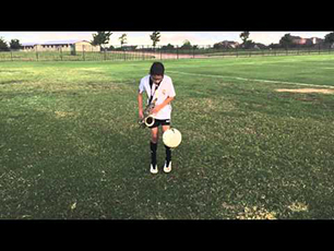 Footballer juggling ball whilst playing the saxophone